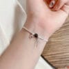 Lắc tay nơ đá phong thuỷ 8 z7858217557452 1b9763e5a6a46fab3c166e476bb45619